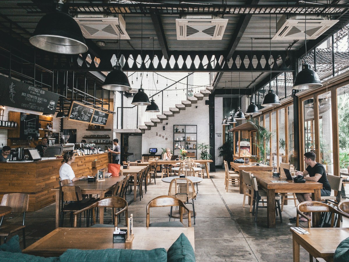 A cafe interior with wooden tables