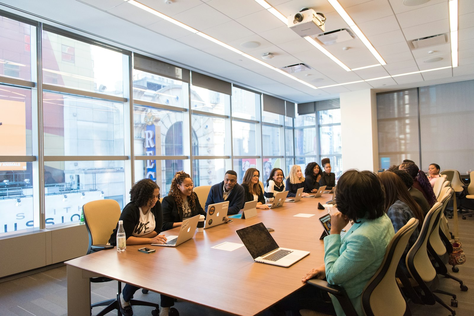 A team reviewing spending on laptops around a table